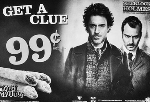 Black and white image from an advertisement for Go Go Taquitos featuring Robert Downey Jr and Jude Law from the movie Sherlock Holmes.